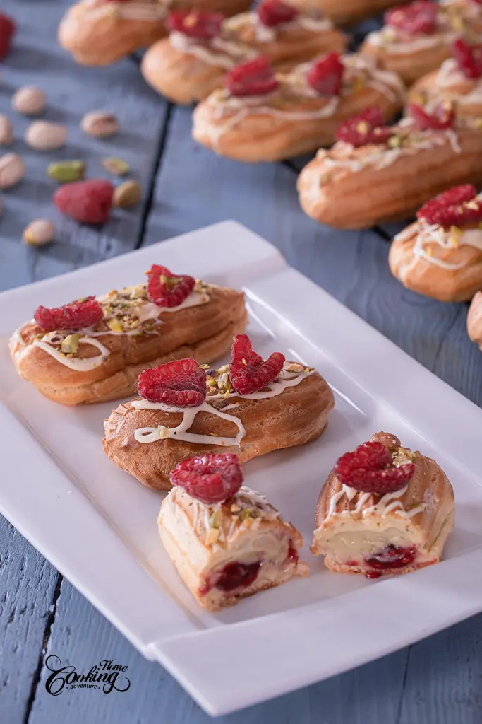Pistachio Raspberry Mini Eclairs - filled with pistachio pastry cream and homemade raspberry jam