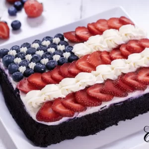 American Flag Cake - chocolate cake decorated with berries and cream cheese frosting