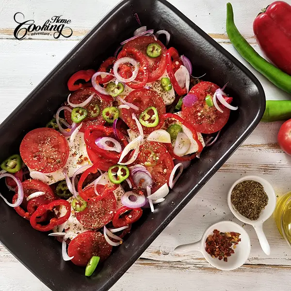 Add Feta cheese and sliced tomatoes