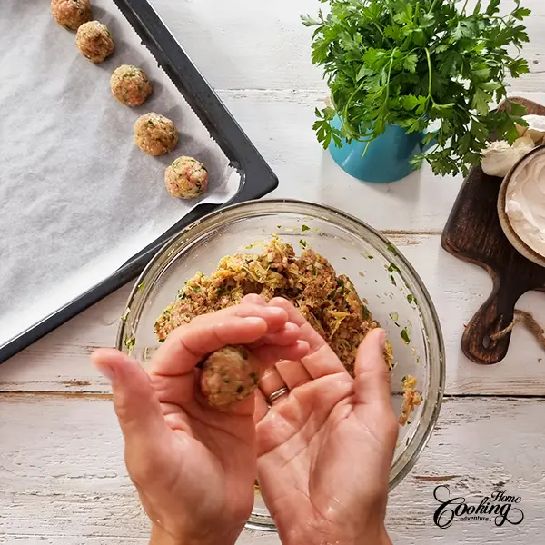 shaping the meatballs