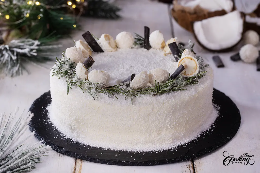Chocolate Coconut Christmas Cake - decorated with rosemary, coconut truffles and chocolate sticks