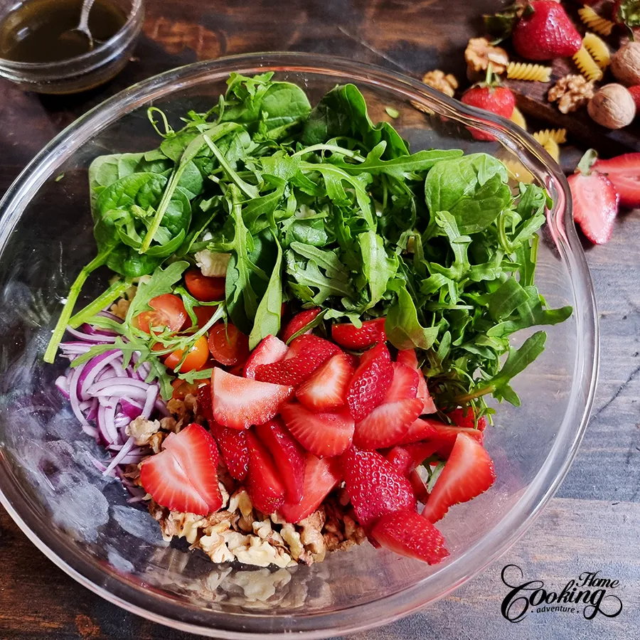 add greens, strawberries and feta