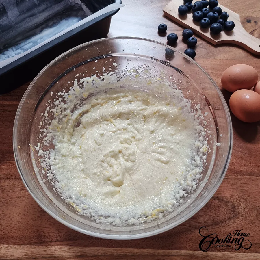 mixing butter with sugar and oil - blueberry lemon pound cake