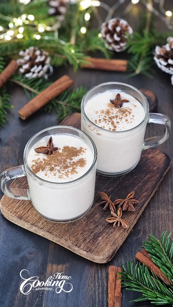 Homemade Eggnog - dusted with cinnamon in glass mugs